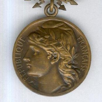 Bronze Medal (stamped “P.TASSET,” 1926-1959) Obverse