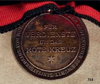 Karl-Olga Medal for Merit in the Red Cross, in Silver Reverse