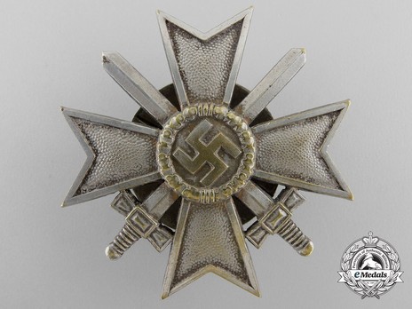 War Merit Cross I Class with Swords, by C. E. Juncker (L/12, tombac, screwback) Obverse